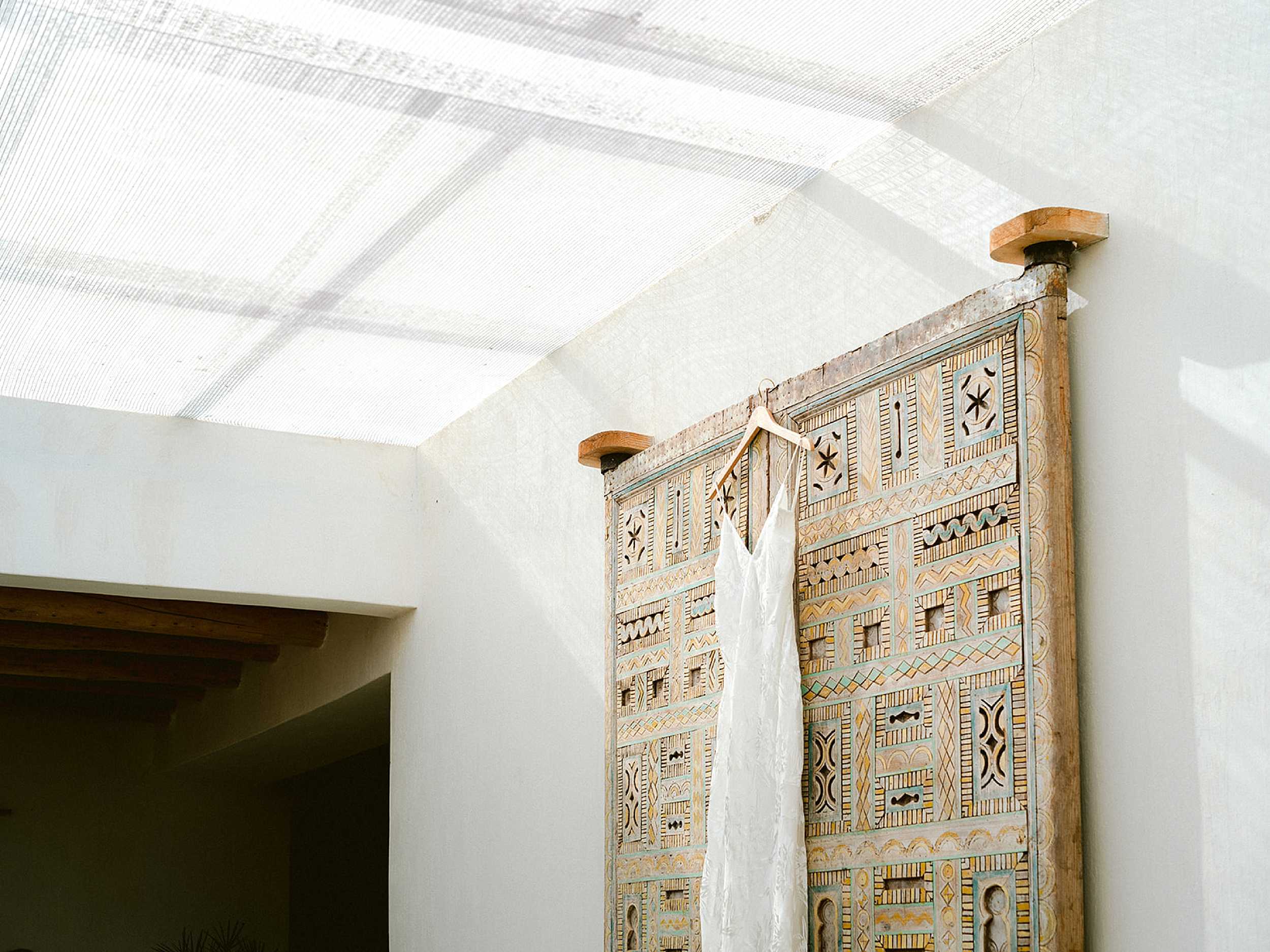 Minimalistic wedding dress at Kasbah Bab Ourika Morocco // Raisa Zwart Photography