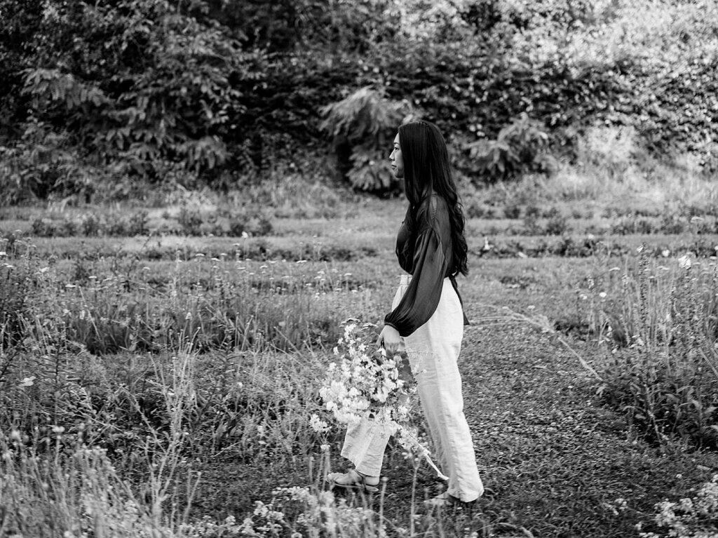 Portrait of floral designer Brittany from Brit Floral in a Belgian garden during a flower retreat