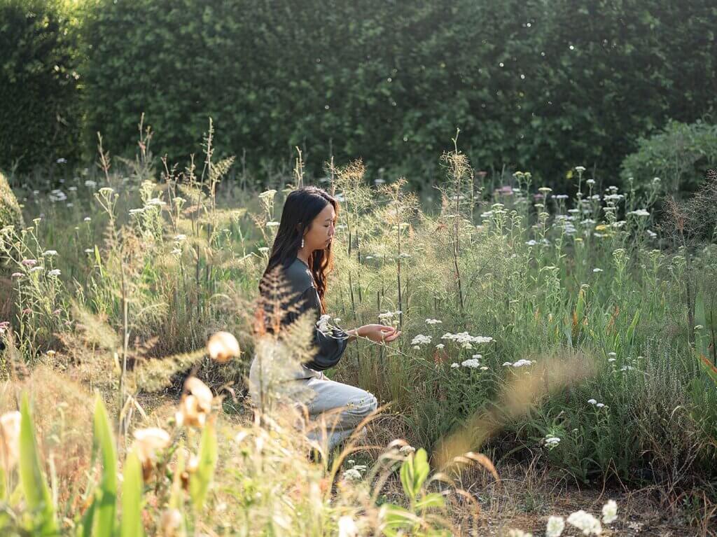 Portrait of floral designer Brittany from Brit Floral in a Belgian garden during a flower retreat