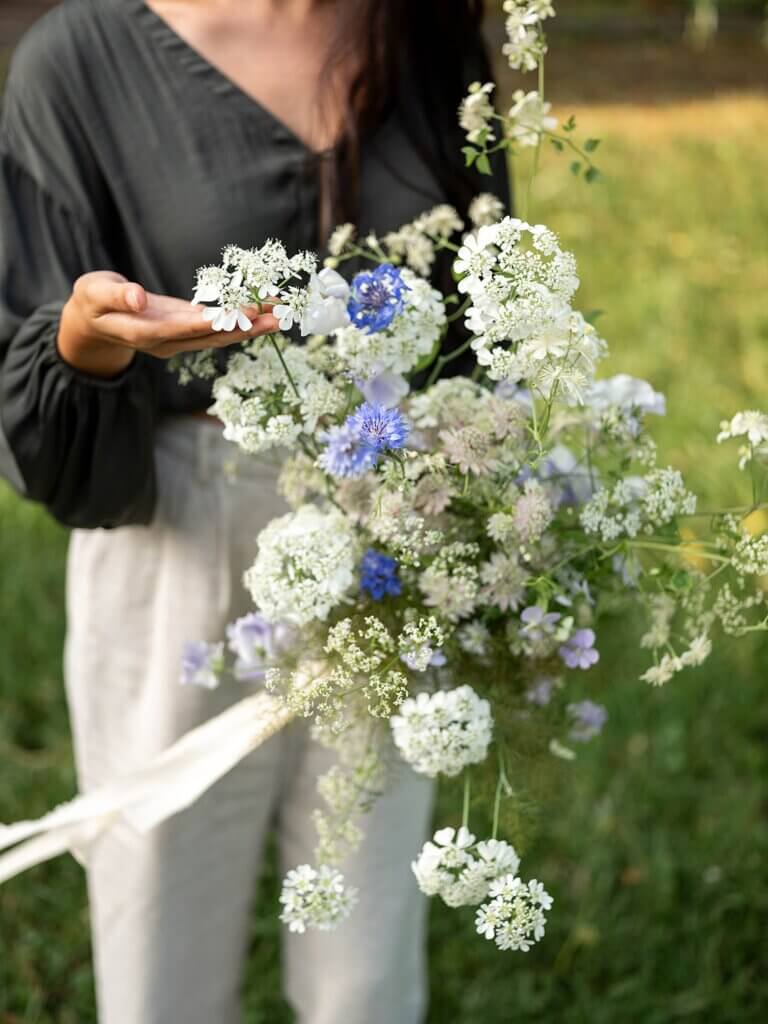 Portrait of floral designer Brittany from Brit Floral in a Belgian garden during a flower retreat