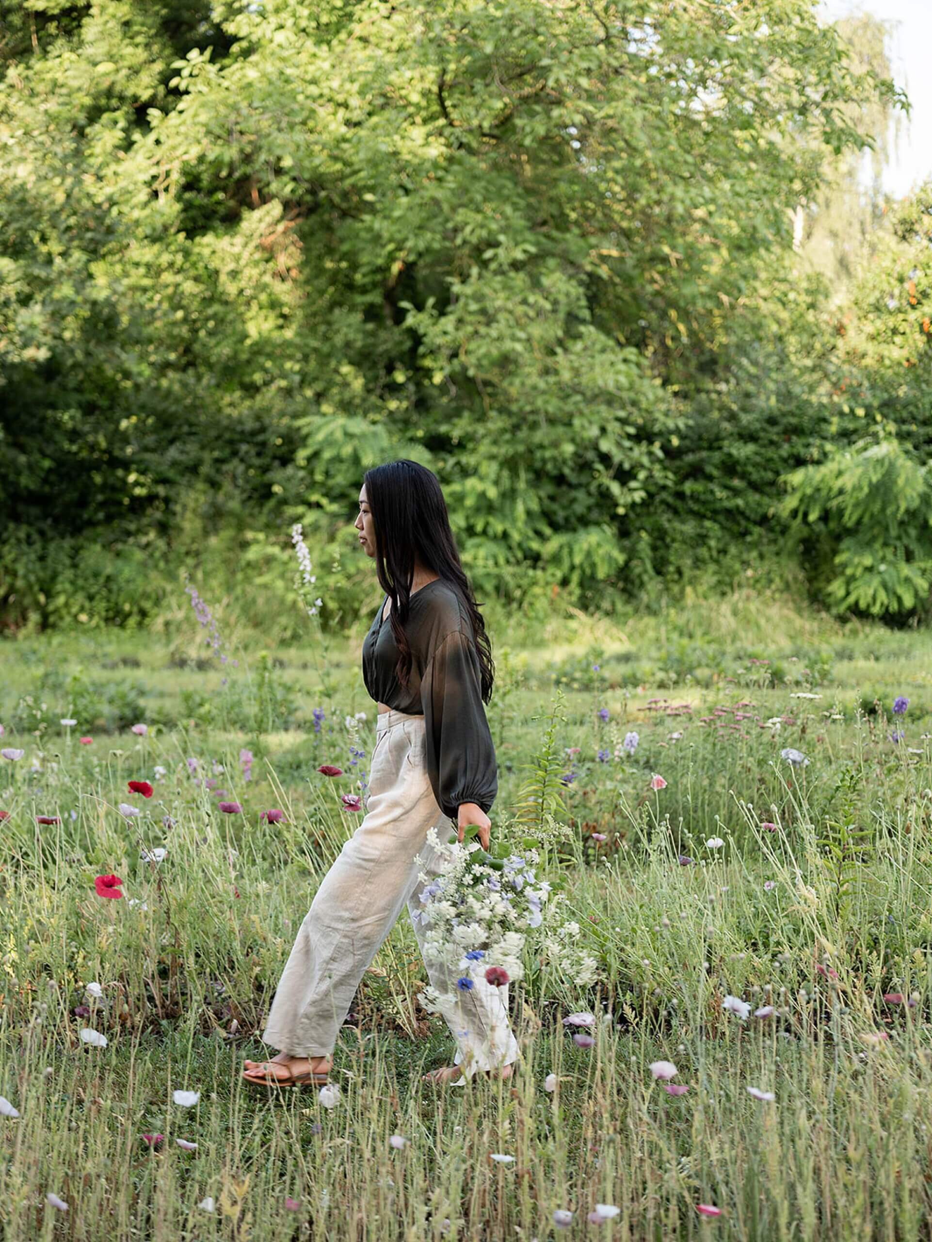 Portrait of floral designer Brittany from Brit Floral in a Belgian garden during a flower retreat